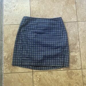 Plaid blue skirt by brand WildFable size 10 with a slit in the side.